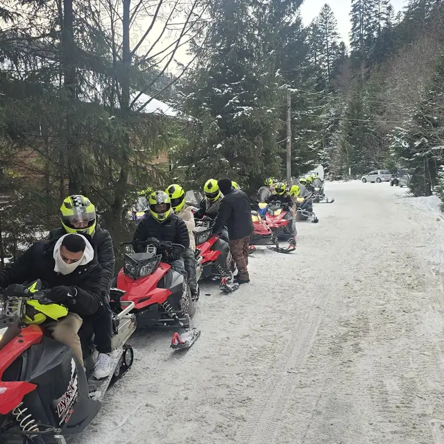 Snowmobile ride through snowy Carpathian forests near Azuga — 5